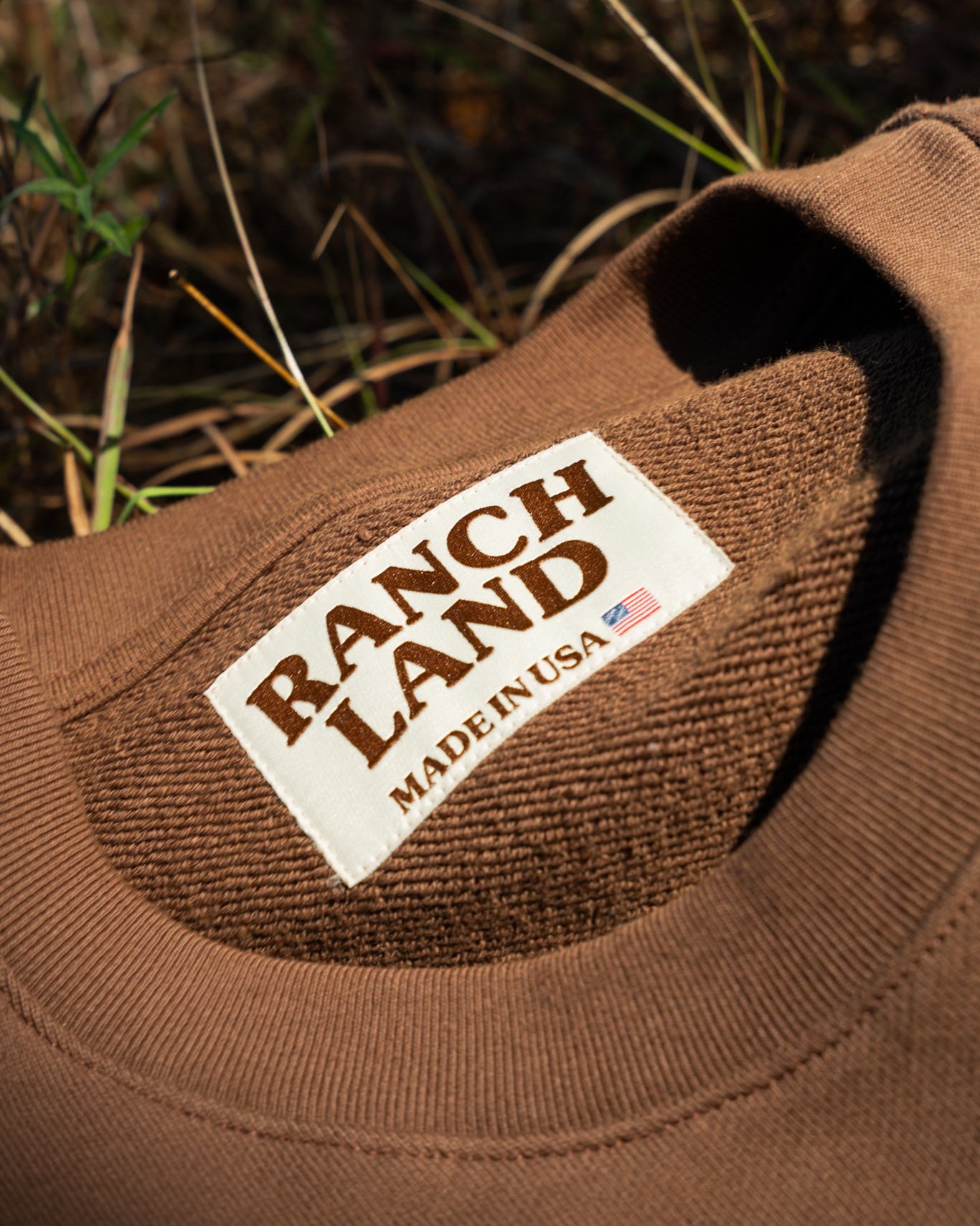 Brown fabric with 'Ranch Land Made in USA' label on a natural background